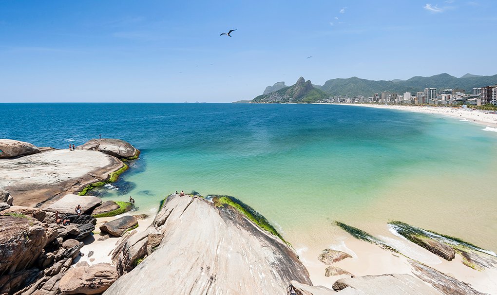 Scenic view of Ipanema Beach with turquoise waters and distant mountains in Rio de Janeiro | MSC Cruises Scenic view of Ipanema Beach with turquoise waters and distant mountains in Rio de Janeiro | MSC Cruises