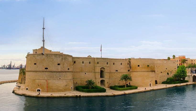 Historic Aragonese Castle in Taranto, Italy, surrounded by water | MSC Cruises