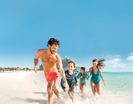 A family running on a sunny beach with an MSC cruise ship in the background | MSC Cruises